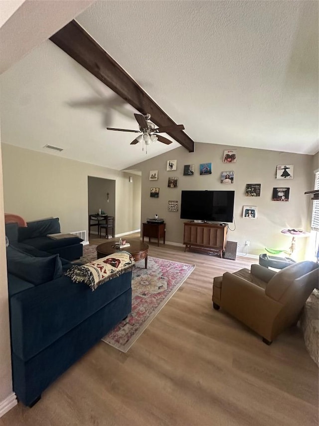 513 Purple Sage Dr, Round Rock, TX 78681 - living room with ceiling fan, wood finished floors, and a textured ceiling
