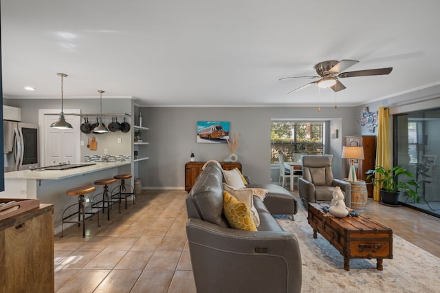 1135 Barton Hills Dr Unit 136, Austin, TX 78704 - living room featuring ceiling fan, light tile patterned flooring, and ornamental molding