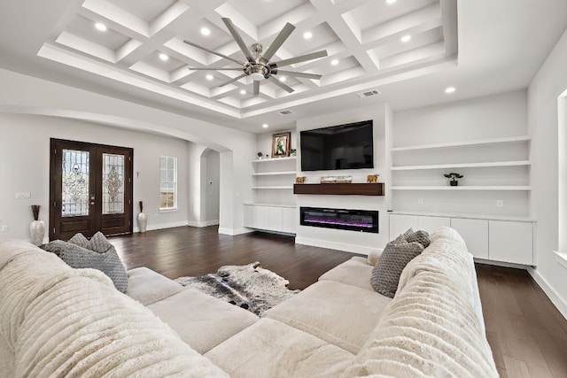 25101 Fawn Dr, Leander, TX 78641 - living area with arched walkways, recessed lighting, dark wood-style flooring, ceiling fan, and baseboards