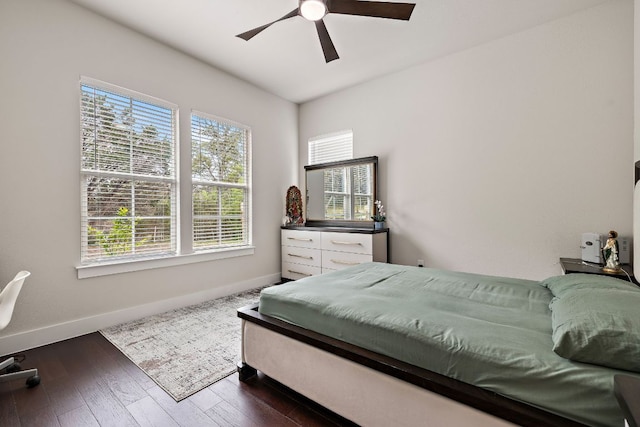 25101 Fawn Dr, Leander, TX 78641 - bedroom with baseboards, dark wood-style flooring, and ceiling fan
