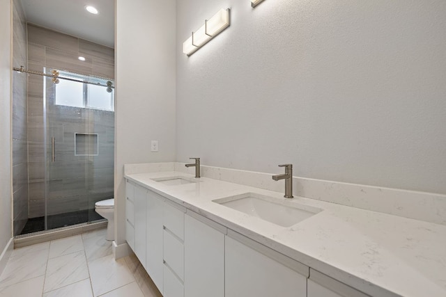 25101 Fawn Dr, Leander, TX 78641 - bathroom featuring double vanity, a shower stall, toilet, marble look tile flooring, and recessed lighting