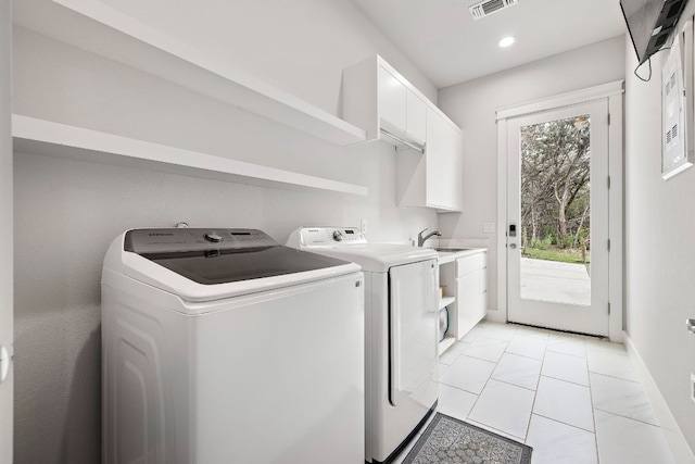 25101 Fawn Dr, Leander, TX 78641 - laundry room featuring washer and clothes dryer, cabinet space, recessed lighting, and baseboards