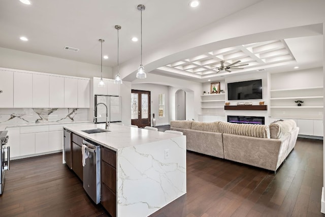 25101 Fawn Dr, Leander, TX 78641 - kitchen with a sink, arched walkways, ceiling fan, modern cabinets, and coffered ceiling