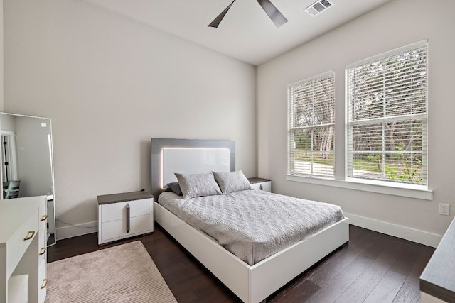 25101 Fawn Dr, Leander, TX 78641 - bedroom featuring baseboards, dark wood-style flooring, and ceiling fan