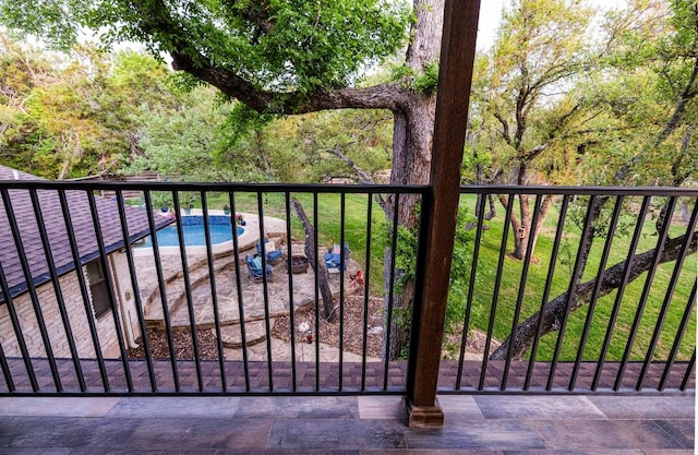 view of gate featuring a pool