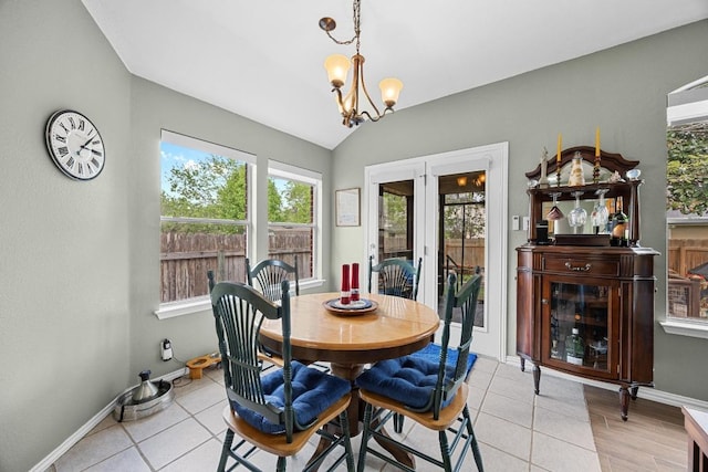2312 Mcgregor Ln, Cedar Park, TX 78613 - dining room with a chandelier, vaulted ceiling, light tile patterned floors, and baseboards