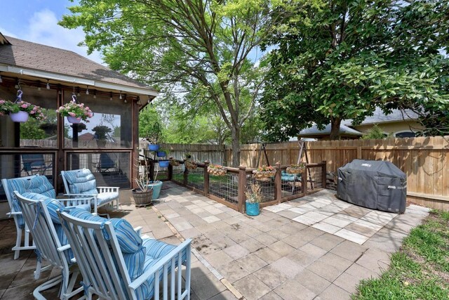 2312 Mcgregor Ln, Cedar Park, TX 78613 - fenced backyard with a grill, a patio area, and outdoor dining space