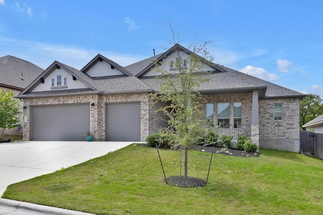 552 Eclipse Dr, Austin, TX 78737 - view of front facade featuring driveway, brick siding, a garage, a shingled roof, and covered porch