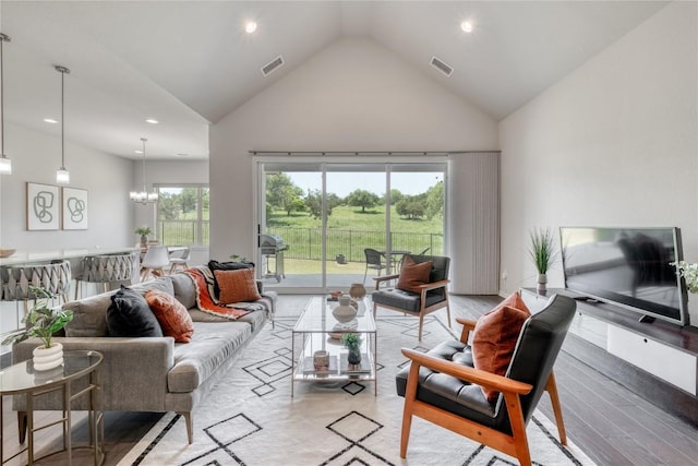 552 Eclipse Dr, Austin, TX 78737 - living area featuring high vaulted ceiling, light wood-style flooring, recessed lighting, and a chandelier