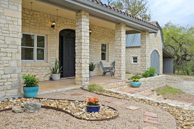 200 Oak Grove Dr, Dripping Springs, TX 78620 - property entrance featuring a porch and stone siding