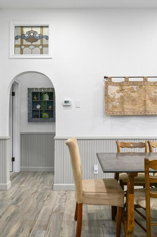 200 Oak Grove Dr, Dripping Springs, TX 78620 - dining area with light wood-style floors and arched walkways