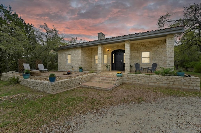 200 Oak Grove Dr, Dripping Springs, TX 78620 - view of front of home featuring a chimney and stone siding