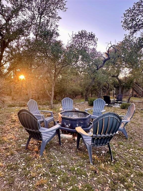 200 Oak Grove Dr, Dripping Springs, TX 78620 - yard at dusk with a fire pit