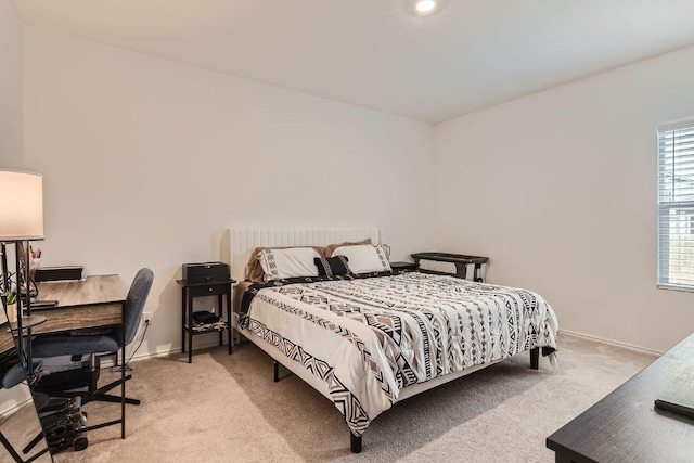 344 The Bad Way, Jarrell, TX 76537 - bedroom featuring light colored carpet, an office area, and baseboards
