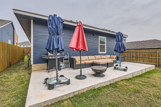 344 The Bad Way, Jarrell, TX 76537 - fenced backyard with an outdoor living space and a patio