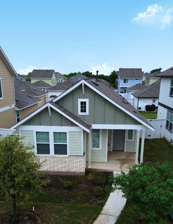 131 Harvest Ridge Blvd, Elgin, TX 78621 - view of front facade featuring board and batten siding and a residential view