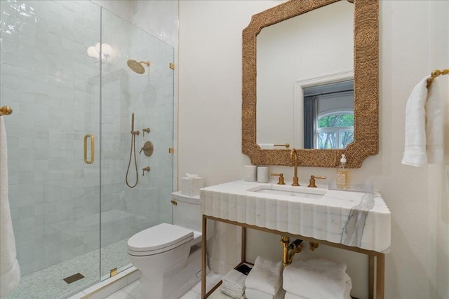24729 Travis Lakeside Cv, Spicewood, TX 78669 - full bath with a sink, toilet, and a shower stall