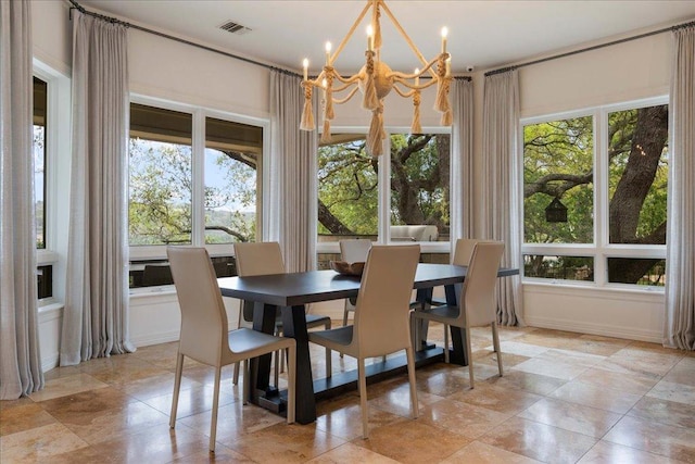 24729 Travis Lakeside Cv, Spicewood, TX 78669 - dining area with a chandelier