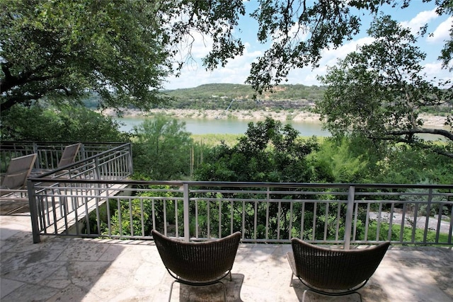 24729 Travis Lakeside Cv, Spicewood, TX 78669 - view of patio / terrace with a water view