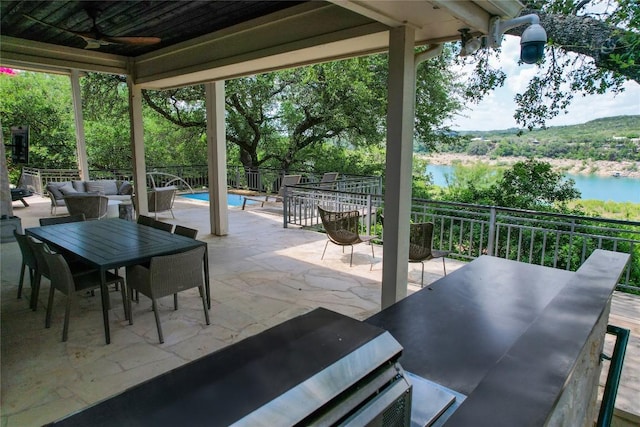 24729 Travis Lakeside Cv, Spicewood, TX 78669 - view of patio / terrace featuring an outdoor hangout area, a ceiling fan, outdoor dining space, and a water view