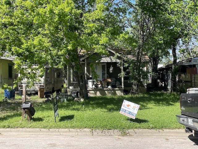 3208 E 16th St, Austin, TX 78721 - obstructed view of property featuring a porch and a front yard