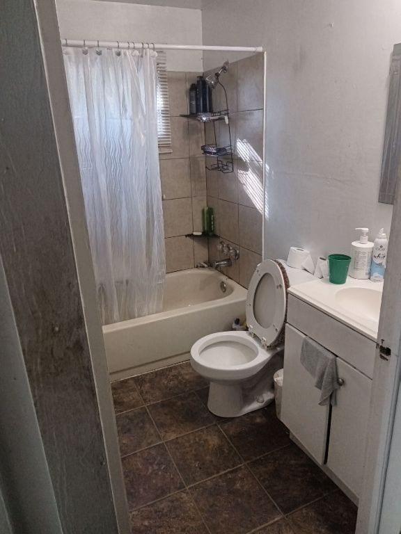 3208 E 16th St, Austin, TX 78721 - bathroom with toilet, shower / bathtub combination with curtain, and vanity