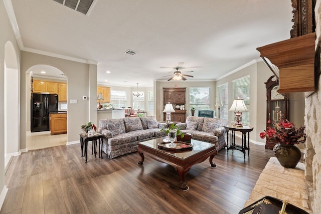 2907 Briona Wood Ln, Cedar Park, TX 78613 - living room with a ceiling fan, light wood-type flooring, ornamental molding, arched walkways, and recessed lighting