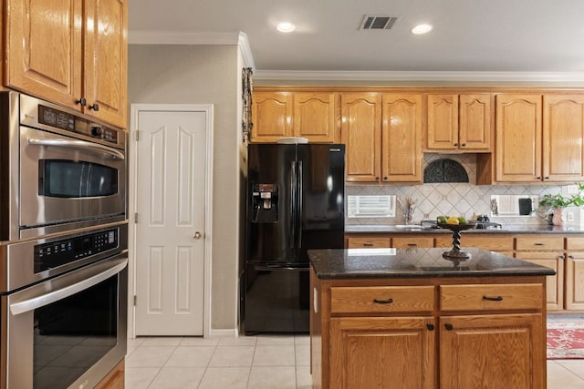 2907 Briona Wood Ln, Cedar Park, TX 78613 - kitchen with black refrigerator with ice dispenser, ornamental molding, double oven, light tile patterned flooring, and tasteful backsplash