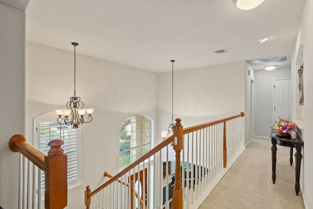 2907 Briona Wood Ln, Cedar Park, TX 78613 - hall with light carpet, a chandelier, and an upstairs landing