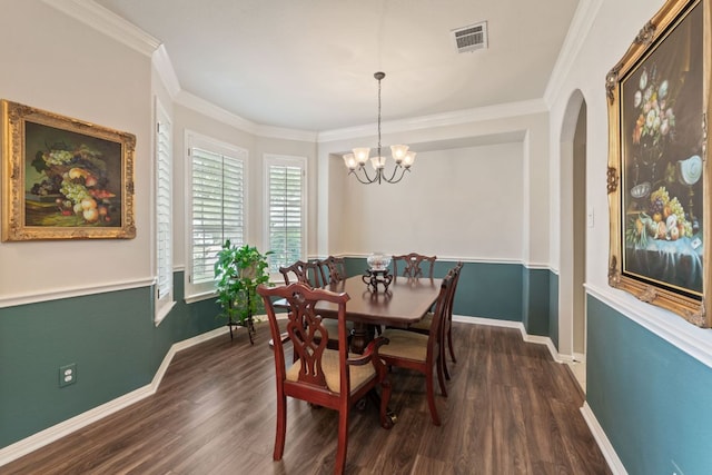 2907 Briona Wood Ln, Cedar Park, TX 78613 - dining area with dark wood finished floors, arched walkways, a chandelier, and crown molding