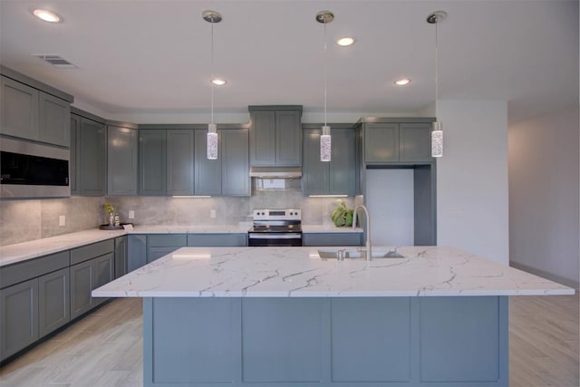 162 Puu Waa Waa Ln, Bastrop, TX 78602 - kitchen with appliances with stainless steel finishes, a sink, decorative backsplash, light stone countertops, and recessed lighting
