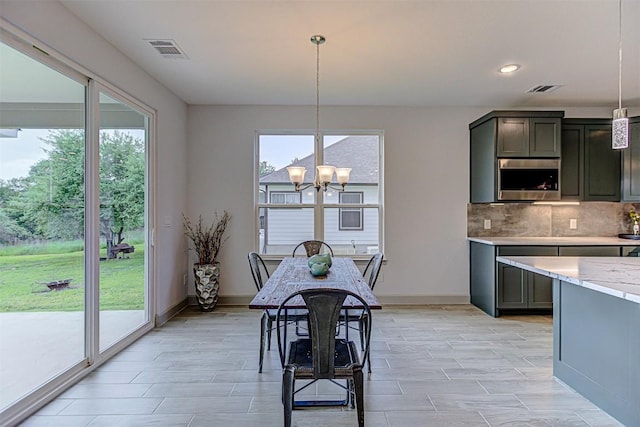 162 Puu Waa Waa Ln, Bastrop, TX 78602 - dining space featuring a chandelier, plenty of natural light, baseboards, and recessed lighting