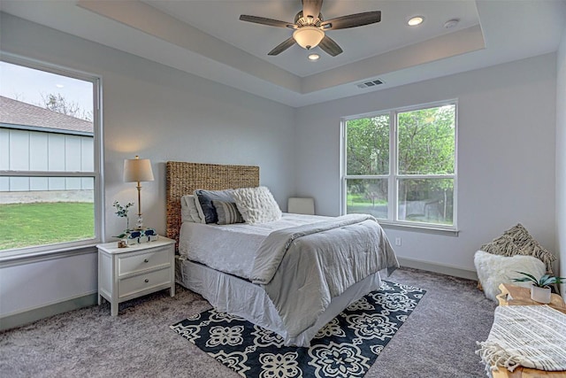 162 Puu Waa Waa Ln, Bastrop, TX 78602 - bedroom featuring carpet, a tray ceiling, baseboards, a ceiling fan, and recessed lighting