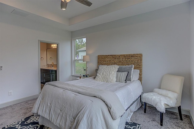 162 Puu Waa Waa Ln, Bastrop, TX 78602 - bedroom with carpet, baseboards, a sink, and connected bathroom