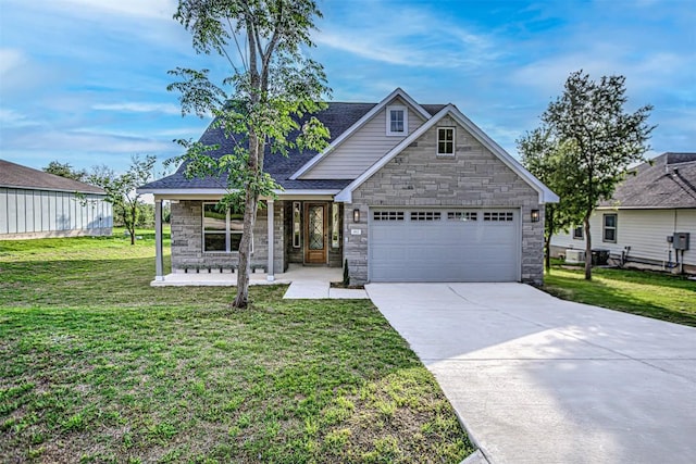 162 Puu Waa Waa Ln, Bastrop, TX 78602 - traditional-style home featuring stone siding, a porch, driveway, and a front lawn