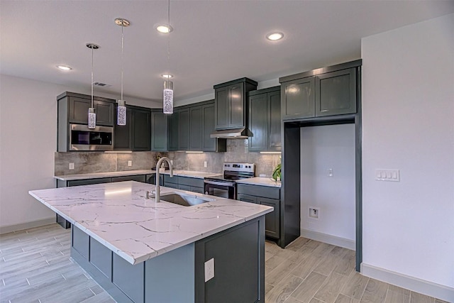 162 Puu Waa Waa Ln, Bastrop, TX 78602 - kitchen with appliances with stainless steel finishes, a sink, decorative backsplash, light stone countertops, and recessed lighting