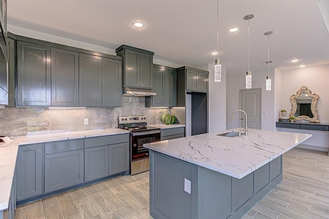 162 Puu Waa Waa Ln, Bastrop, TX 78602 - kitchen featuring appliances with stainless steel finishes, a sink, light stone countertops, under cabinet range hood, and tasteful backsplash