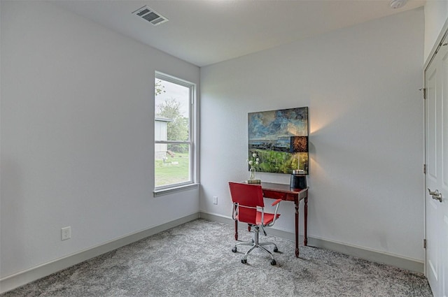 home office with carpet floors and baseboards