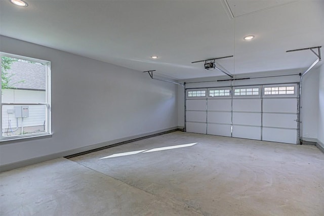 162 Puu Waa Waa Ln, Bastrop, TX 78602 - garage featuring a garage door opener and recessed lighting
