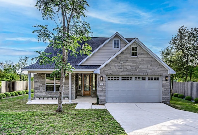 162 Puu Waa Waa Ln, Bastrop, TX 78602 - traditional home with stone siding, a garage, concrete driveway, roof with shingles, and covered porch