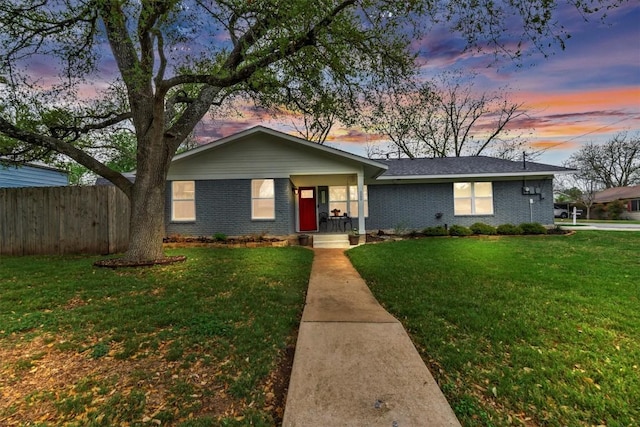 1701 Davis St, Taylor, TX 76574 - single story home with brick siding and covered porch