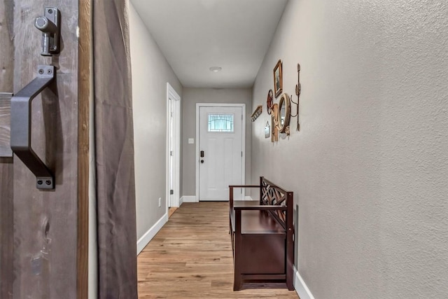 1701 Davis St, Taylor, TX 76574 - entryway featuring light wood-type flooring and baseboards