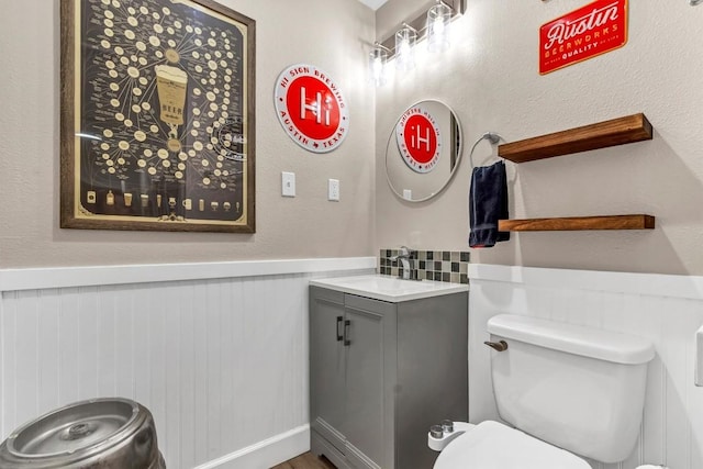 1701 Davis St, Taylor, TX 76574 - half bathroom with vanity and wainscoting