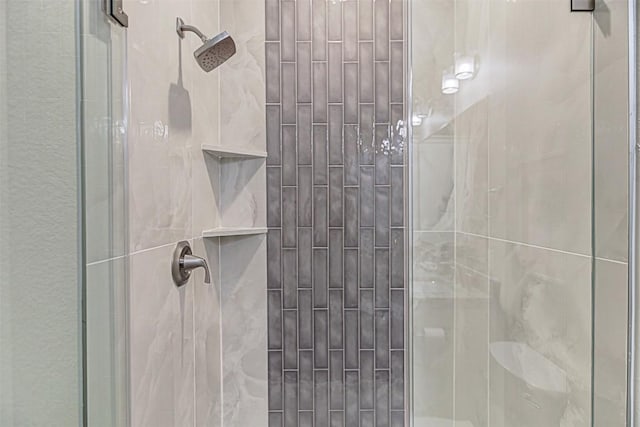 full bath featuring a shower stall