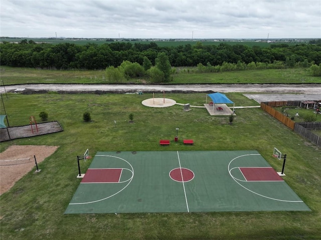view of sport court with a yard, fence, and community basketball court