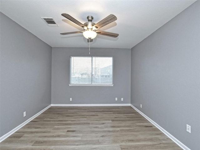 118 Dogwood Dr, Georgetown, TX 78626 - empty room featuring baseboards, visible vents, a ceiling fan, and wood finished floors