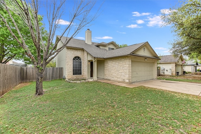 118 Dogwood Dr, Georgetown, TX 78626 - traditional-style house with stone siding, an attached garage, concrete driveway, a front yard, and roof with shingles