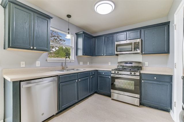 118 Dogwood Dr, Georgetown, TX 78626 - kitchen featuring pendant lighting, light countertops, a sink, and stainless steel appliances