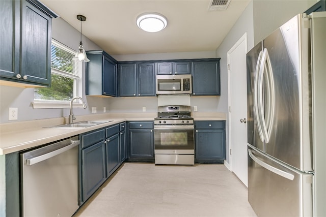 118 Dogwood Dr, Georgetown, TX 78626 - kitchen featuring light countertops, decorative light fixtures, a sink, visible vents, and appliances with stainless steel finishes