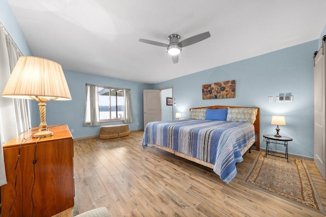 932 Scenic Loop, Kingsland, TX 78639 - bedroom with light wood finished floors and a ceiling fan